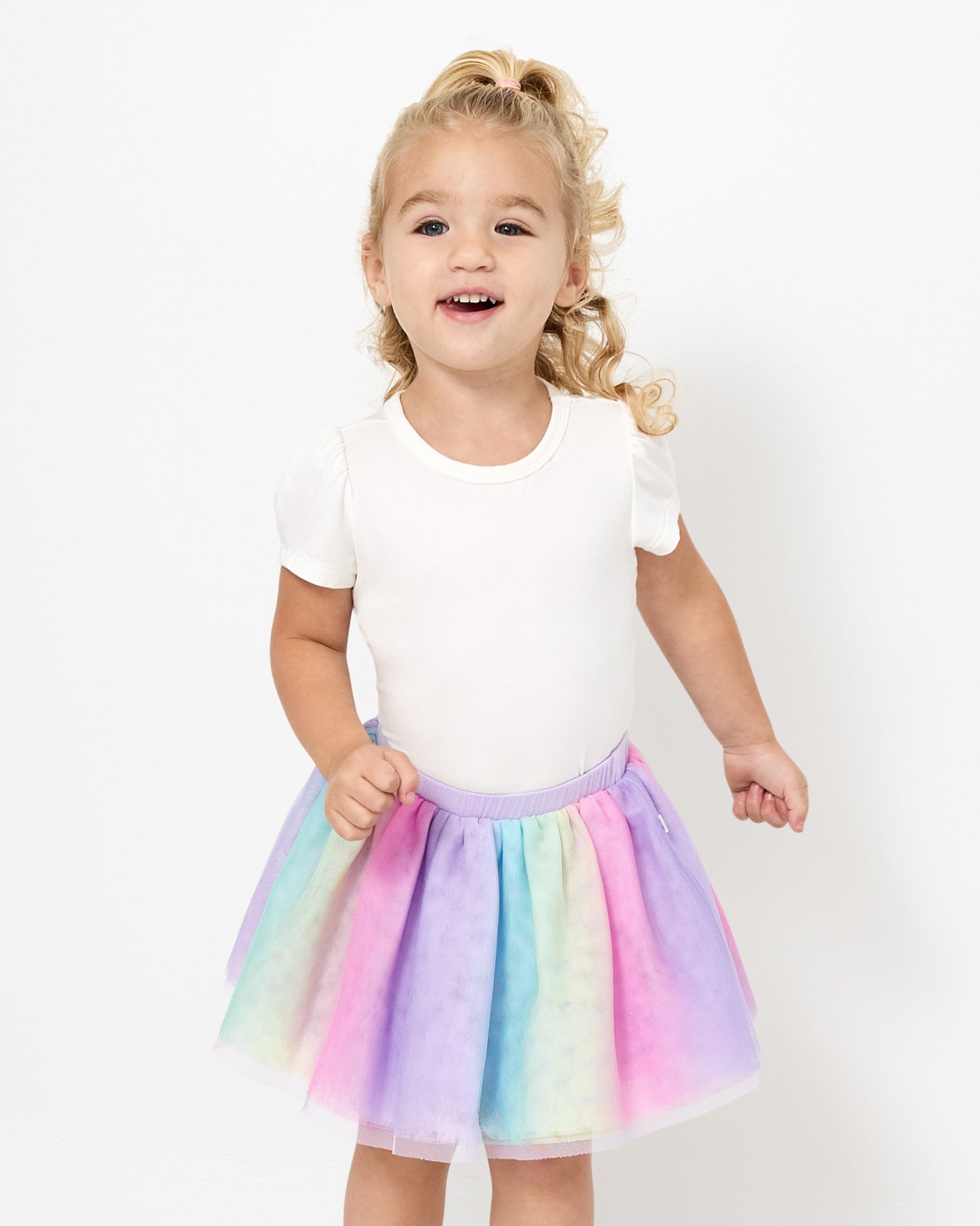 Girl wearing the Rainbow Tutu Skirt with a white girls shirt