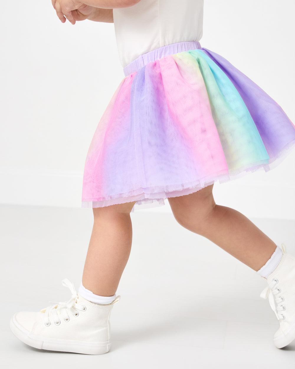 Running girl wearing the Rainbow Tutu Skirt
