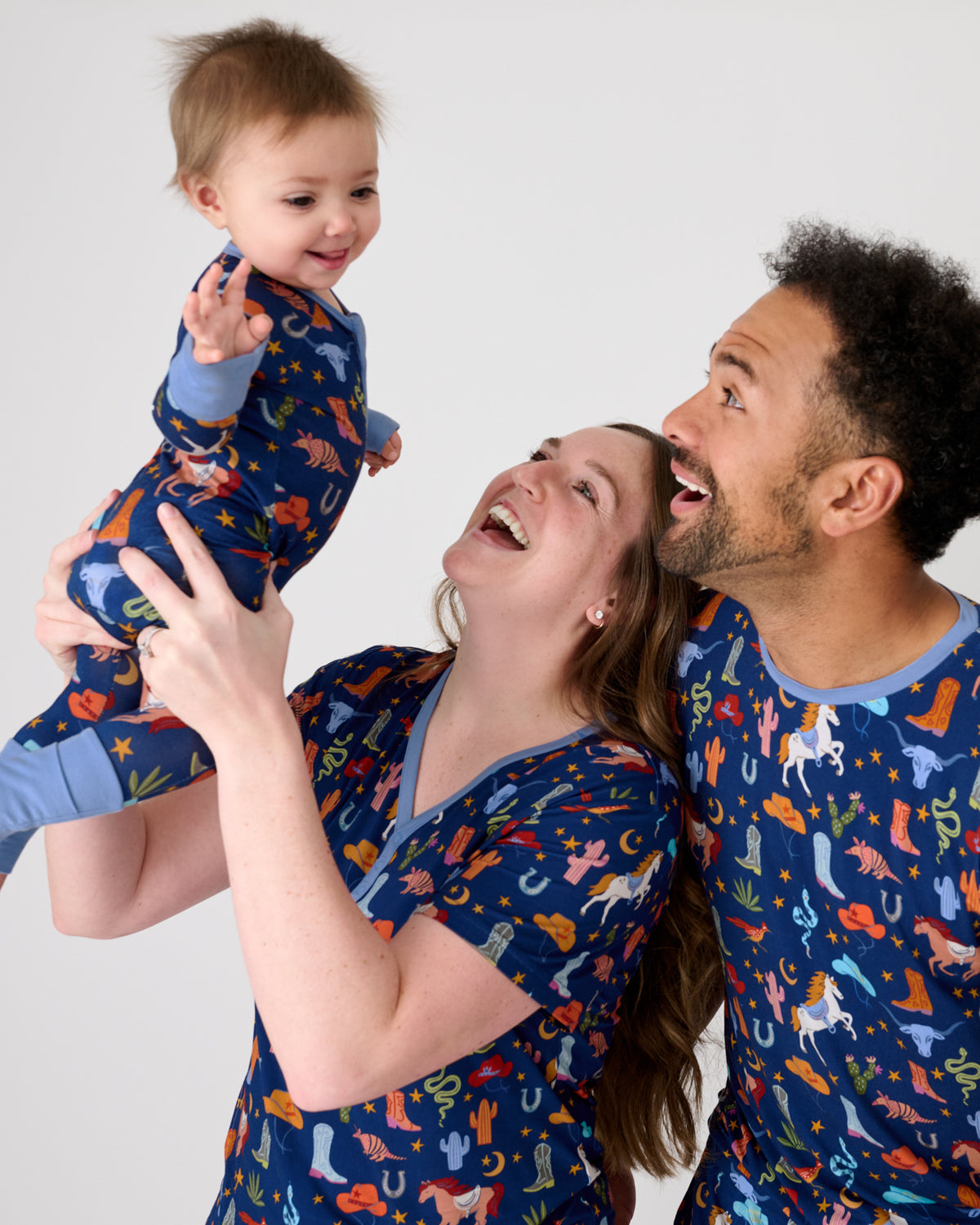 Family of three wearing matching Blue Rancher Roundup Bamboo Pajamas
