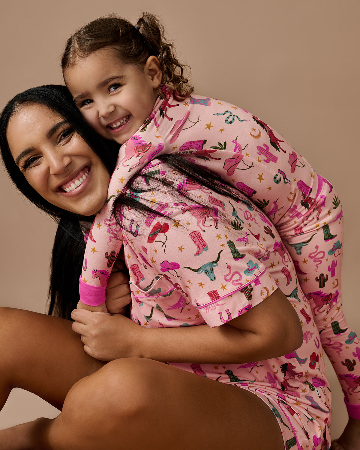 Mother and daughter wearing matching Pink Rancher Roundup Two-Piece Pajama Sets
