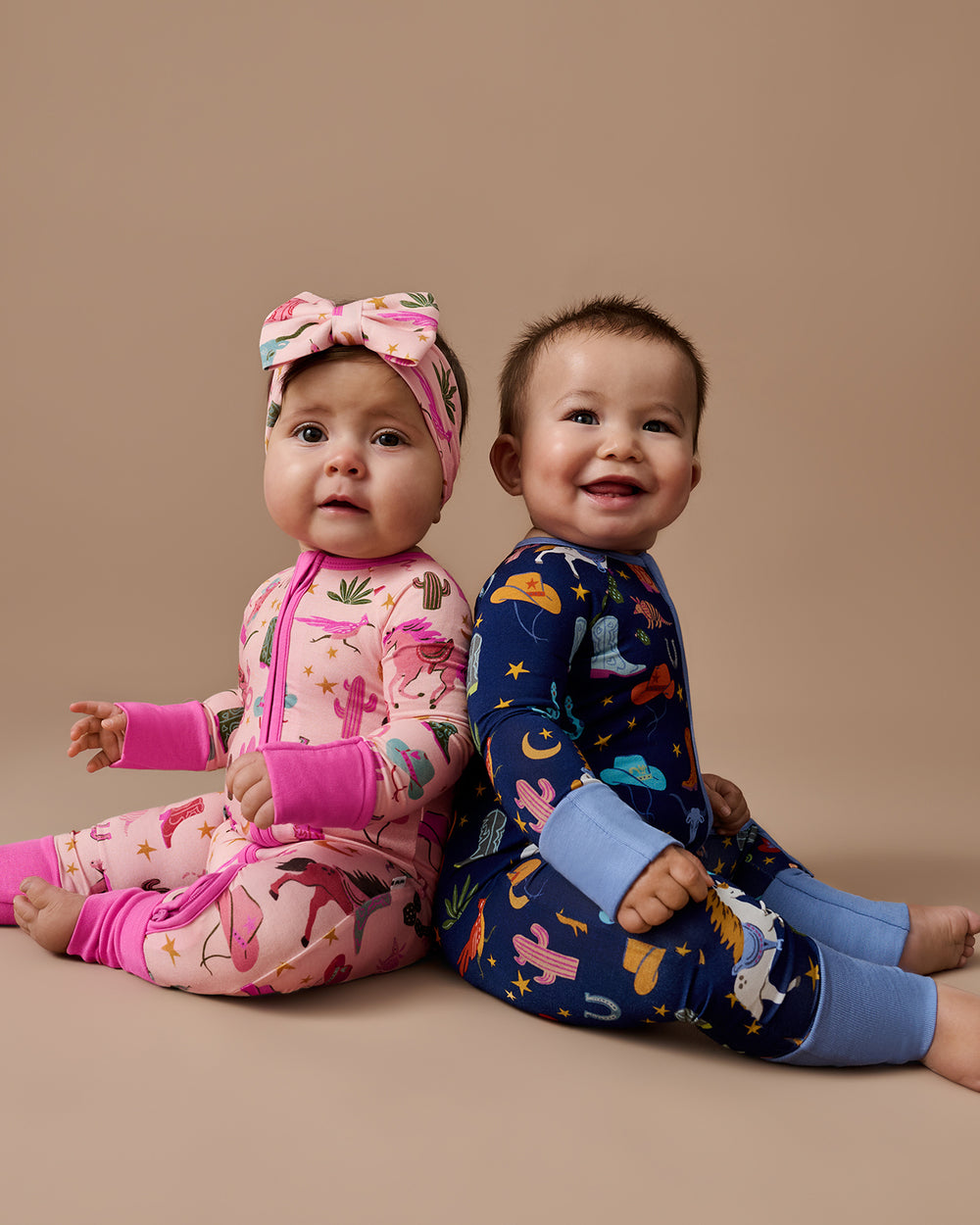 Two babies wearing matching Rancher Roundup Zippys
