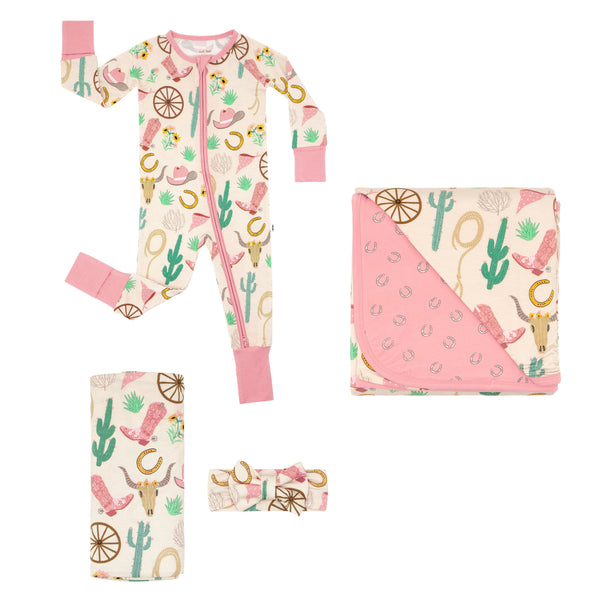 Composite flat lay image of a Pink Ready to Rodeo Zippy, Large Cloud Blanket, and Swaddle and Luxe Bow Headband Set
