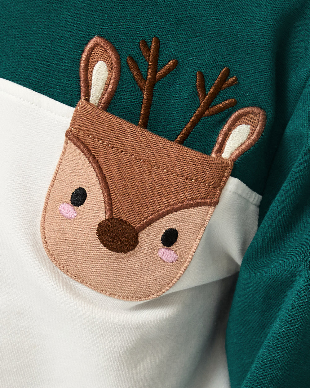 Close up of the reindeer pocket on the Reindeer Cinched Pocket Sweatshirt