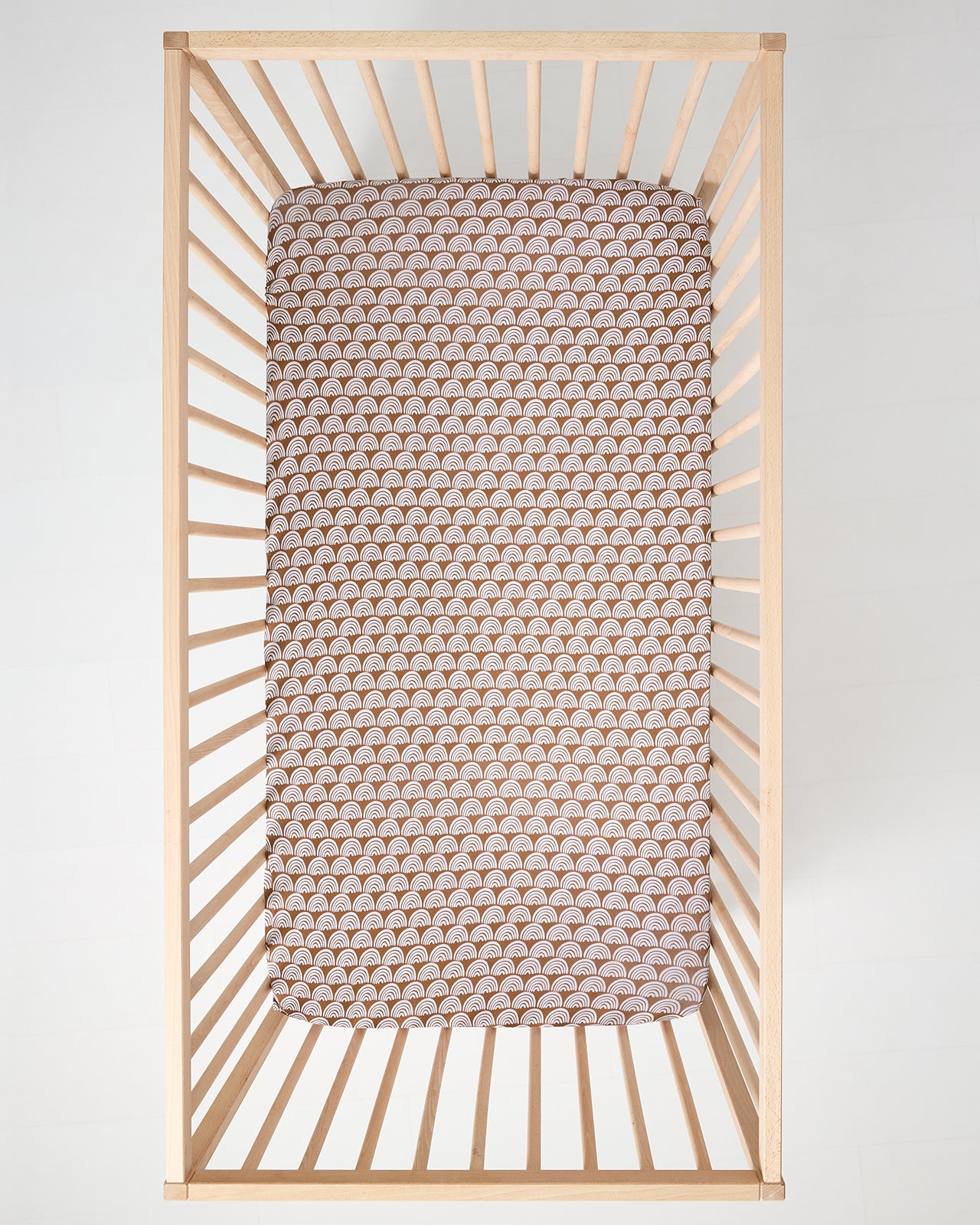 Aerial view of the Rust Rainbows Fitted Crib Sheet