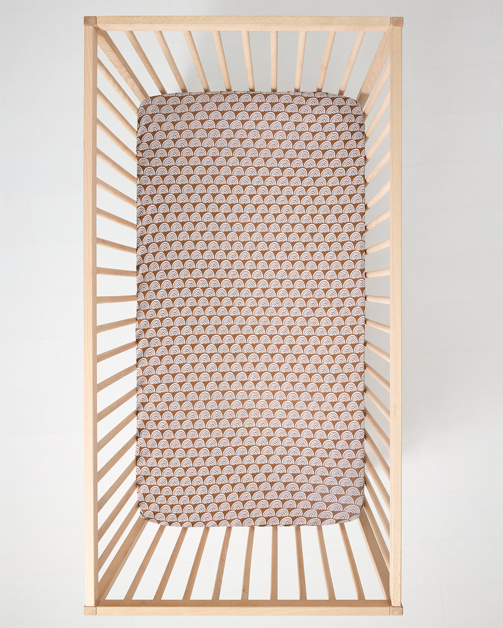 Aerial view of the Rust Rainbows Fitted Crib Sheet