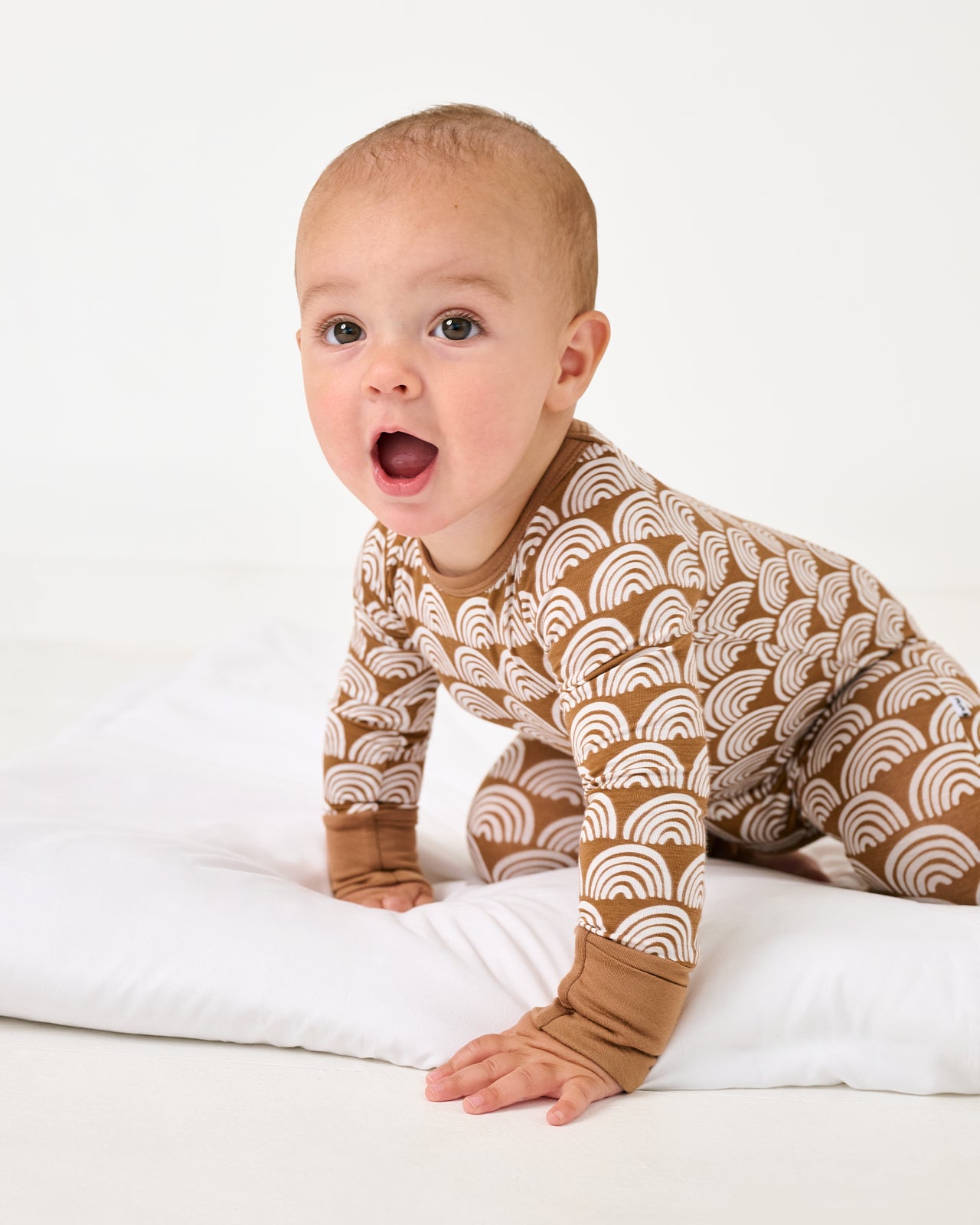 Alternate of crawling abby wearing the Rust Rainbows Crescent Zippy