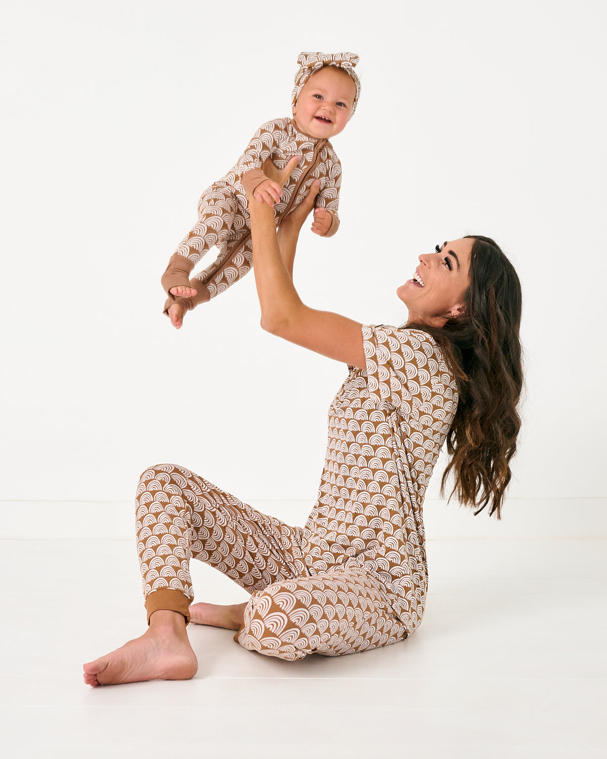 Mother and daughter wearing matching Rust Rainbows pajamas