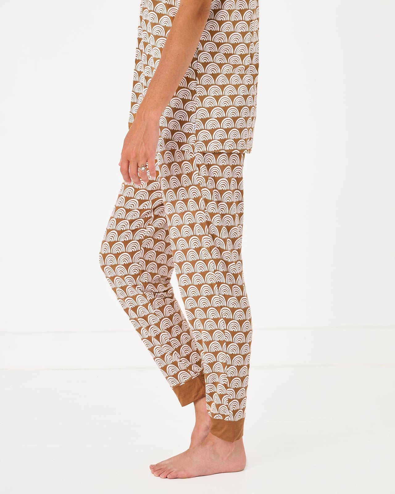 Side view of woman wearing the Rust Rainbows Women's Pajama Pants