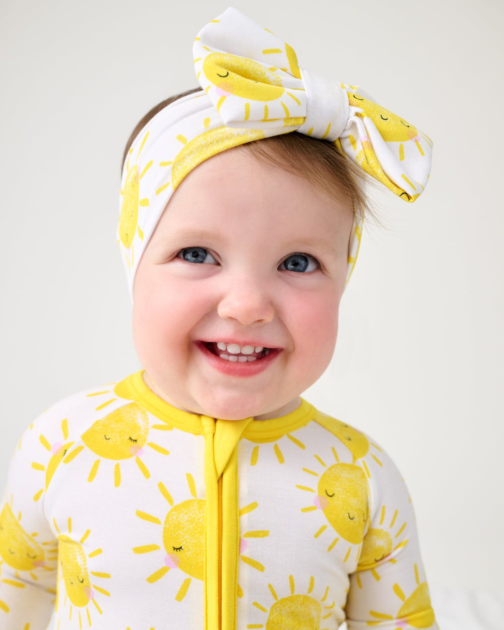 Close up of baby girl wearing the Sunshine Luxe Bow Headband