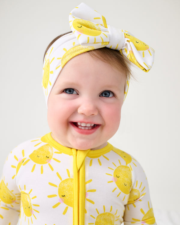 Close up of baby girl wearing the Sunshine Luxe Bow Headband