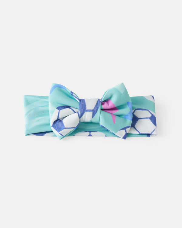 Flat lay of the Aqua Soccer Stars Luxe Bow Headband