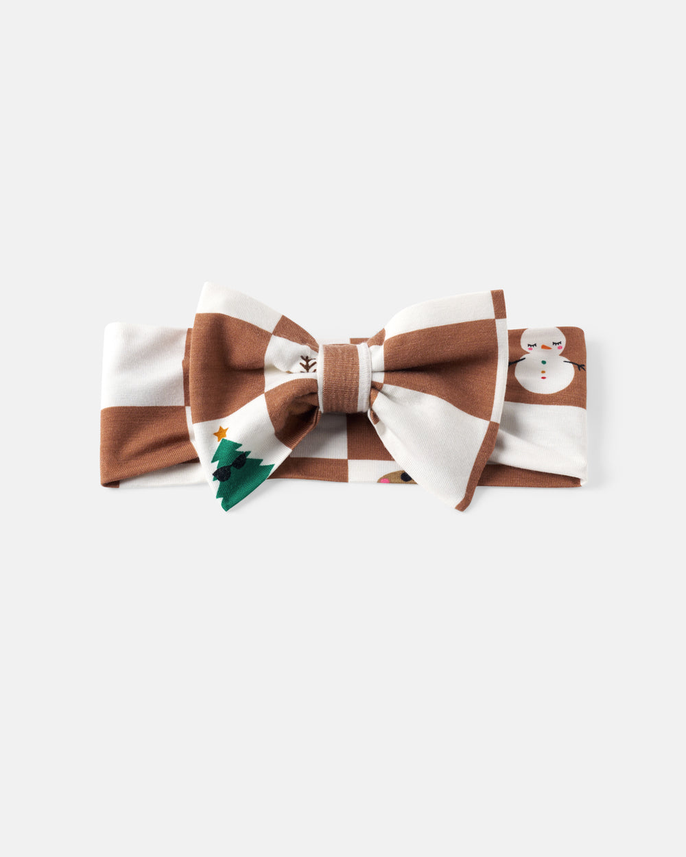 A brown and white checkered bow headband, decorated with a small green Christmas tree and a white snowman graphic, on a light gray background.