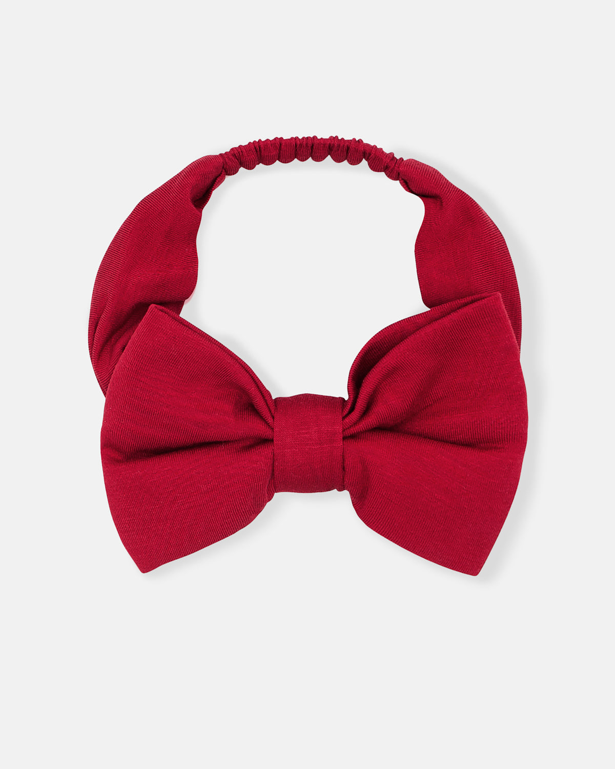 Flat lay of the big kid Holiday Red Luxe Bow Headband
