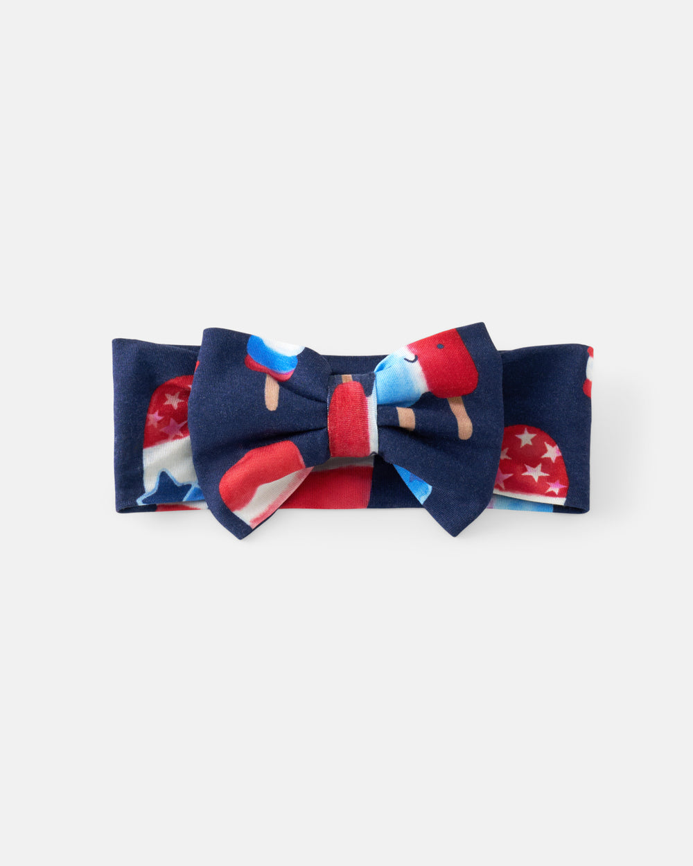 Flat lay of the Sparkle Treats Luxe Bow Headband