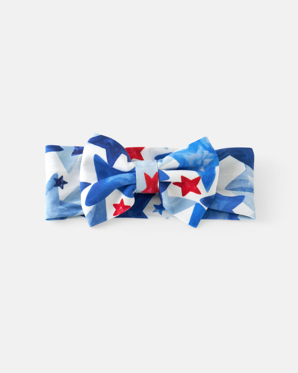 Flat lay of the Starry Splash Luxe Bow Headband