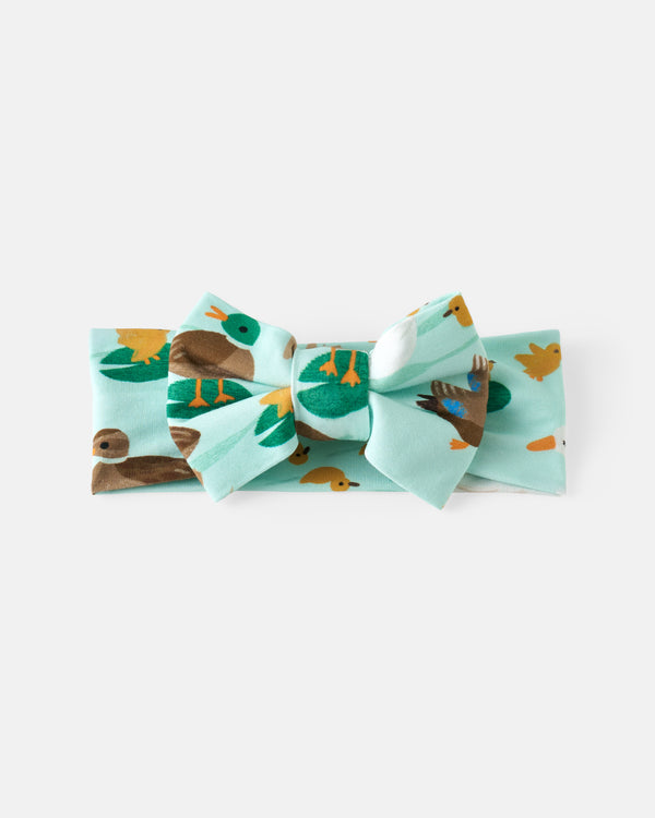 Flat lay of the Puddle Jumpers Luxe Bow Headband