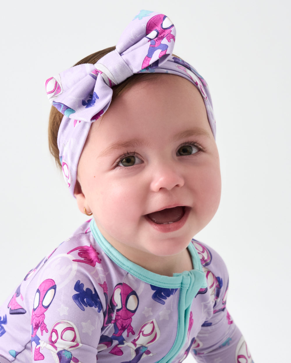 Girl wearing the Spidey & Friends Tiny Webs Luxe Bow Headband