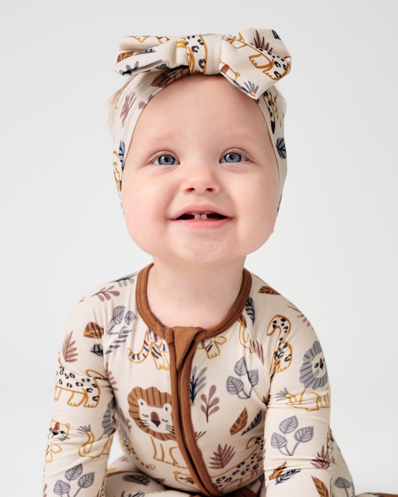Close up of baby girl wearing the Savanna Friends Luxe Bow Headband