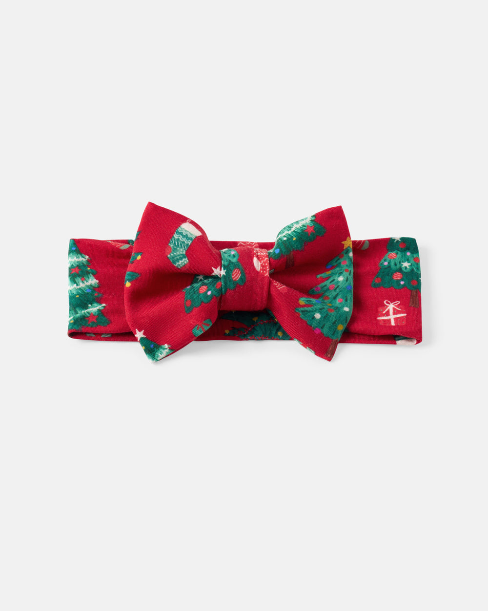 A red fabric bow tie with a green Christmas tree and holly pattern, displayed flat against a light gray background.