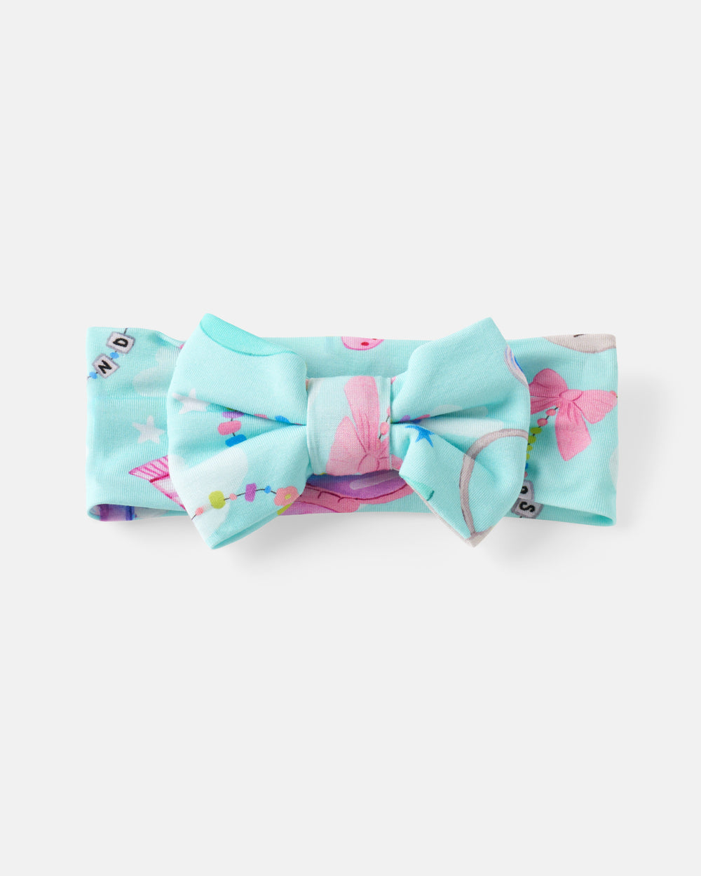 Flat lay of the Slumber Club Luxe Bow Headband