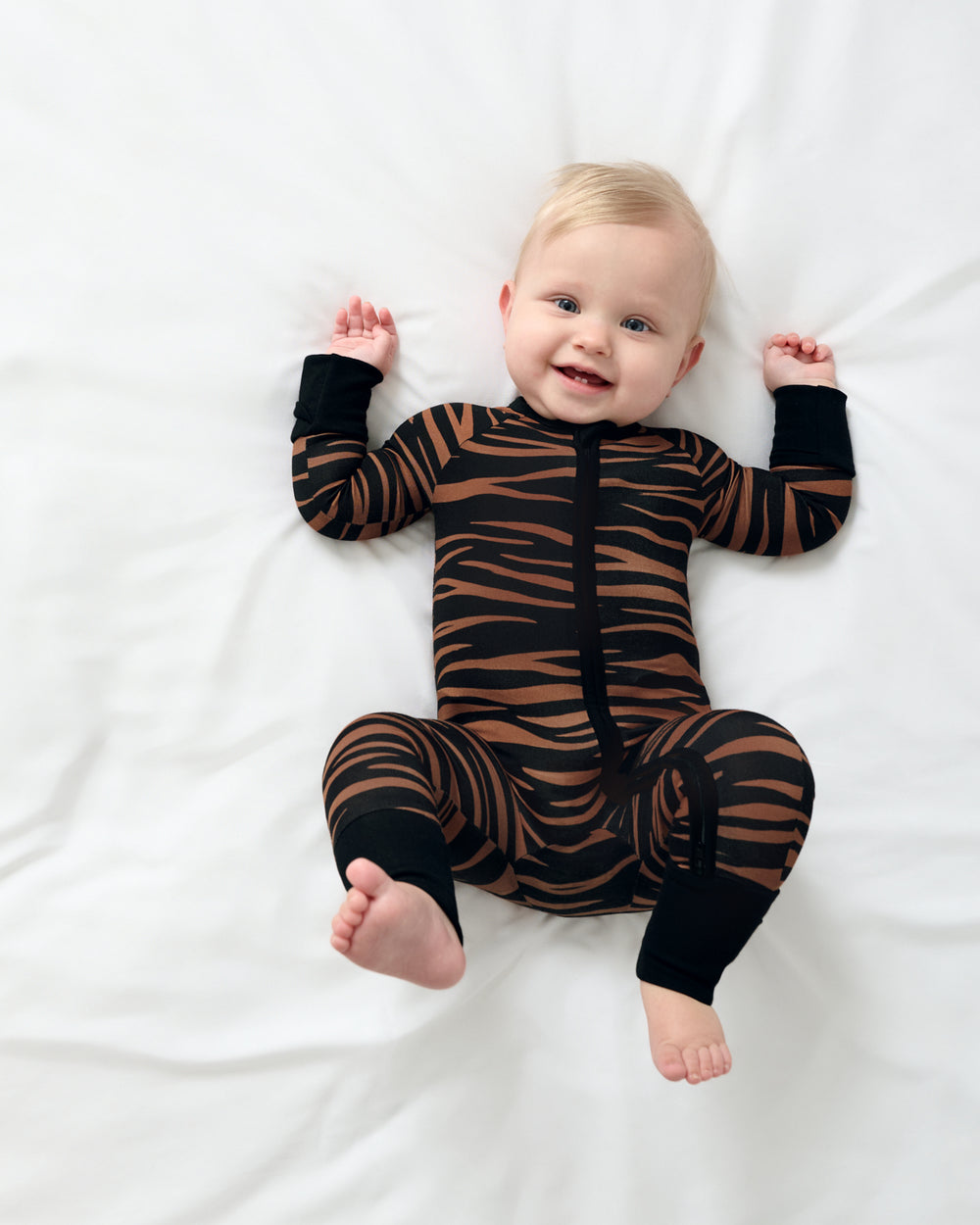 Aerial view of baby wearing the Wild Stripes Zippy