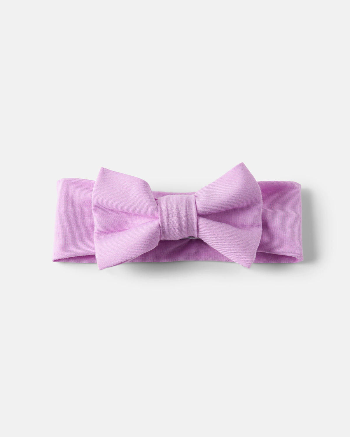 Flat lay of the Soft Wisteria Luxe Bow Headband