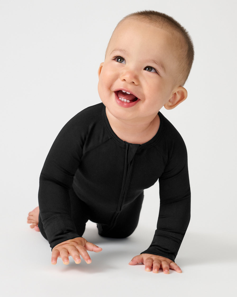 Crawling baby wearing the Black Zippy