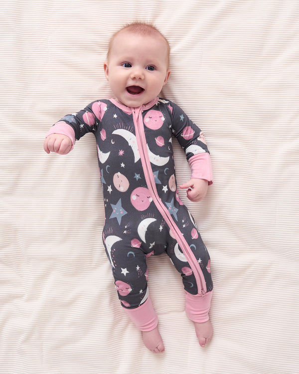Aerial view of baby wearing the Pink To the Moon & Back Zippy
