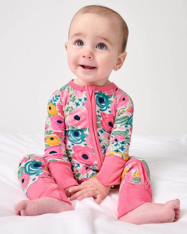 Sitting baby wearing the Secret Garden Zippy
