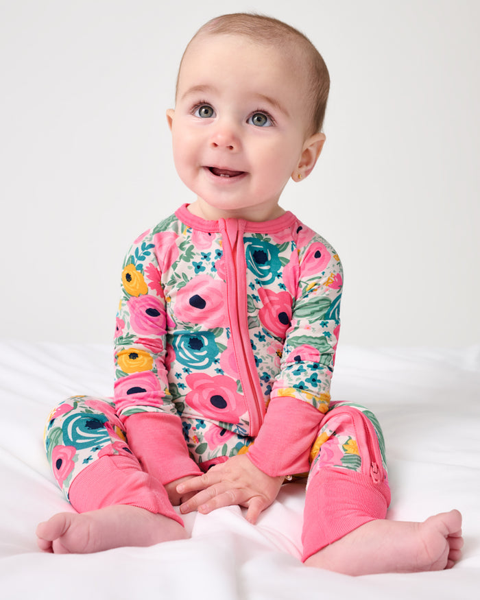Sitting baby wearing the Secret Garden Zippy