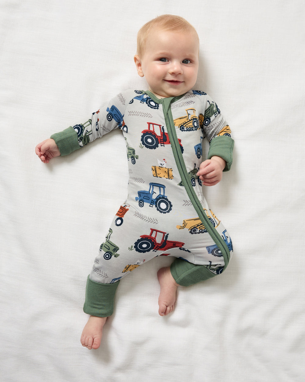 Aerial view of newborn wearing the Tractor Tales Zippy