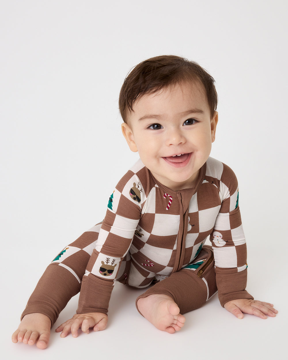 Baby boy wearing the Holiday Checks Zippy