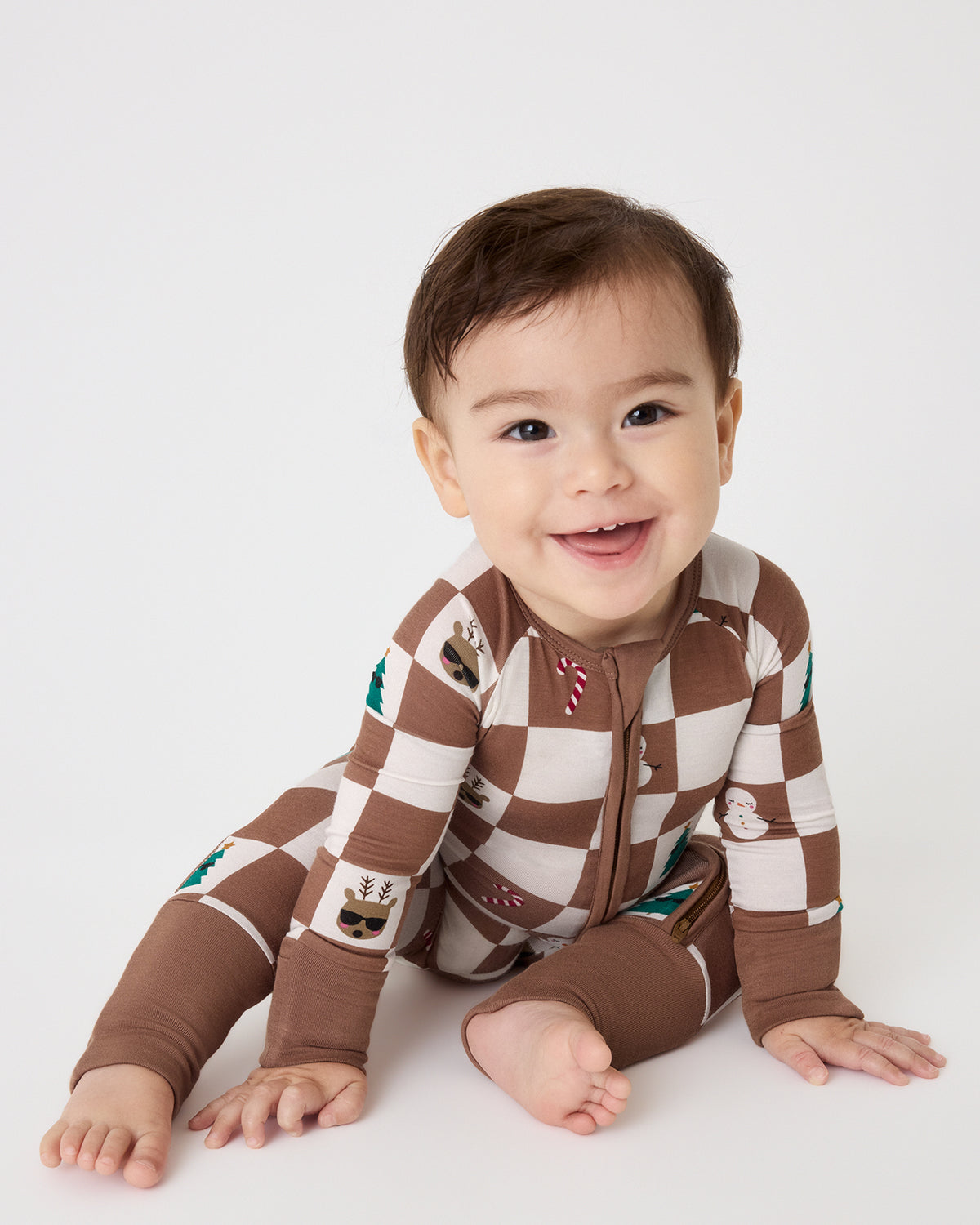 Baby boy wearing the Holiday Checks Zippy
