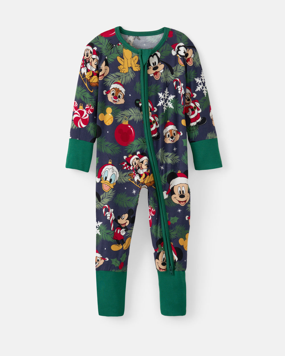 A children's full-zip footed pajama featuring a festive Christmas print with Mickey Mouse, Goofy, and other Disney characters on a dark navy background, with green cuffs and legs.
