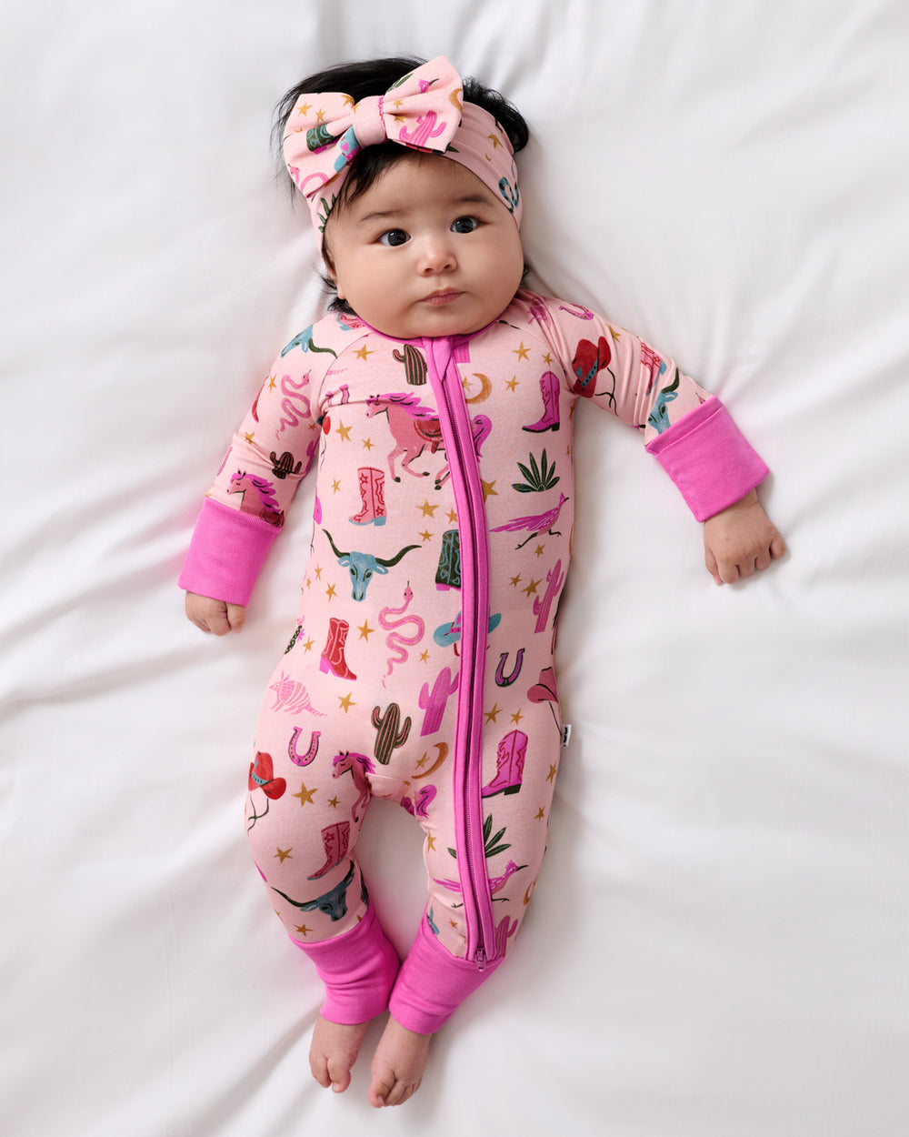 Aerial view of baby wearing the Pink Rancher Roundup Luxe Bow Headband