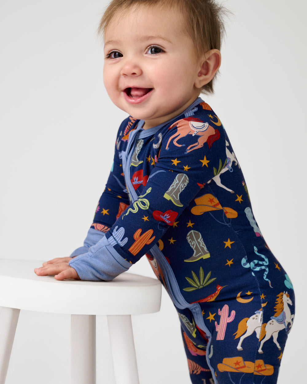 Close up of baby wearing the Blue Rancher Roundup Zippy