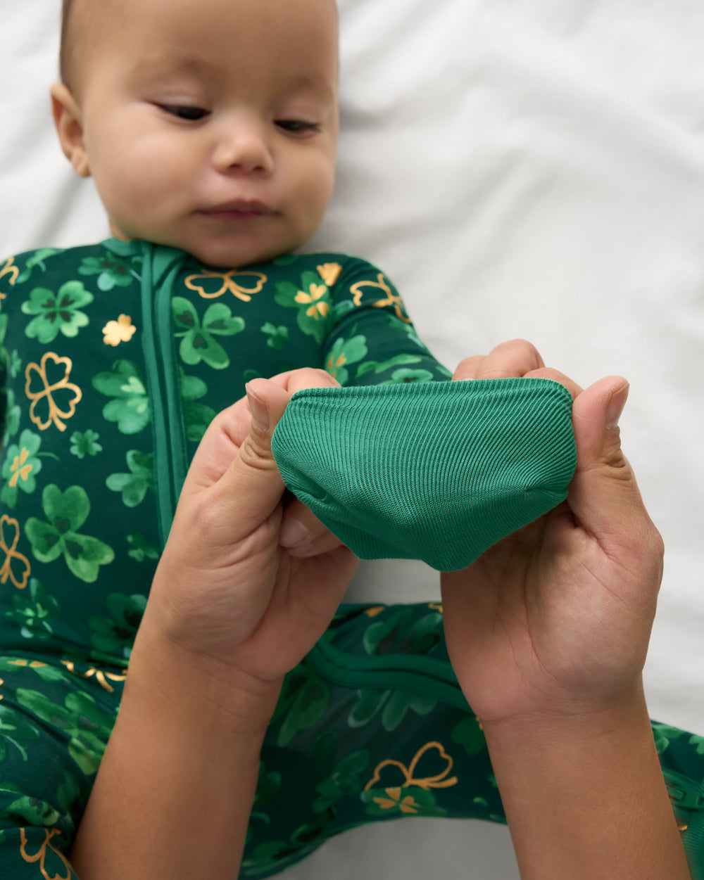 Adult demonstrating the hand covers on the Clover Cuties Zippy