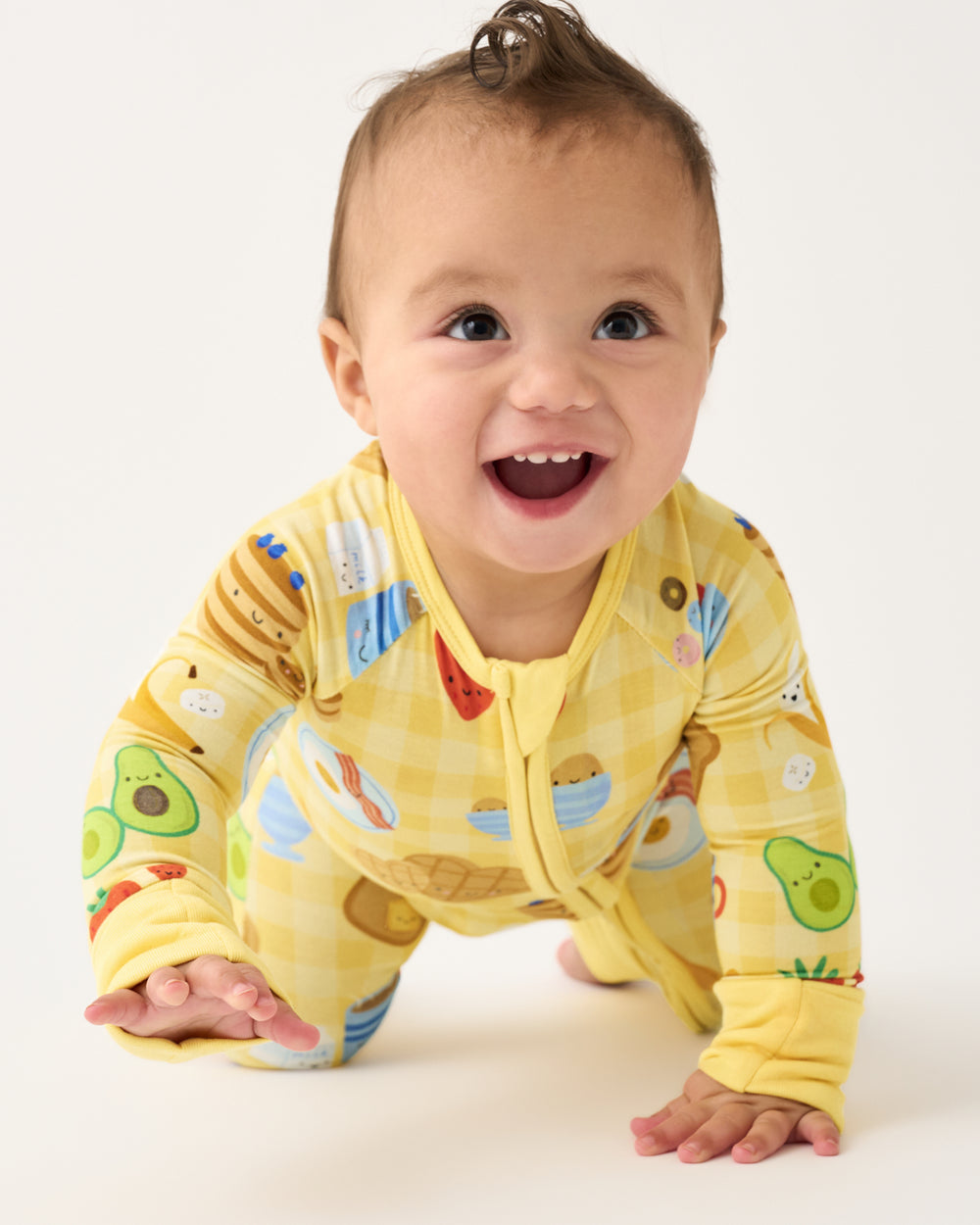 Crawling baby wearing the Breakfast Bunch Zippy