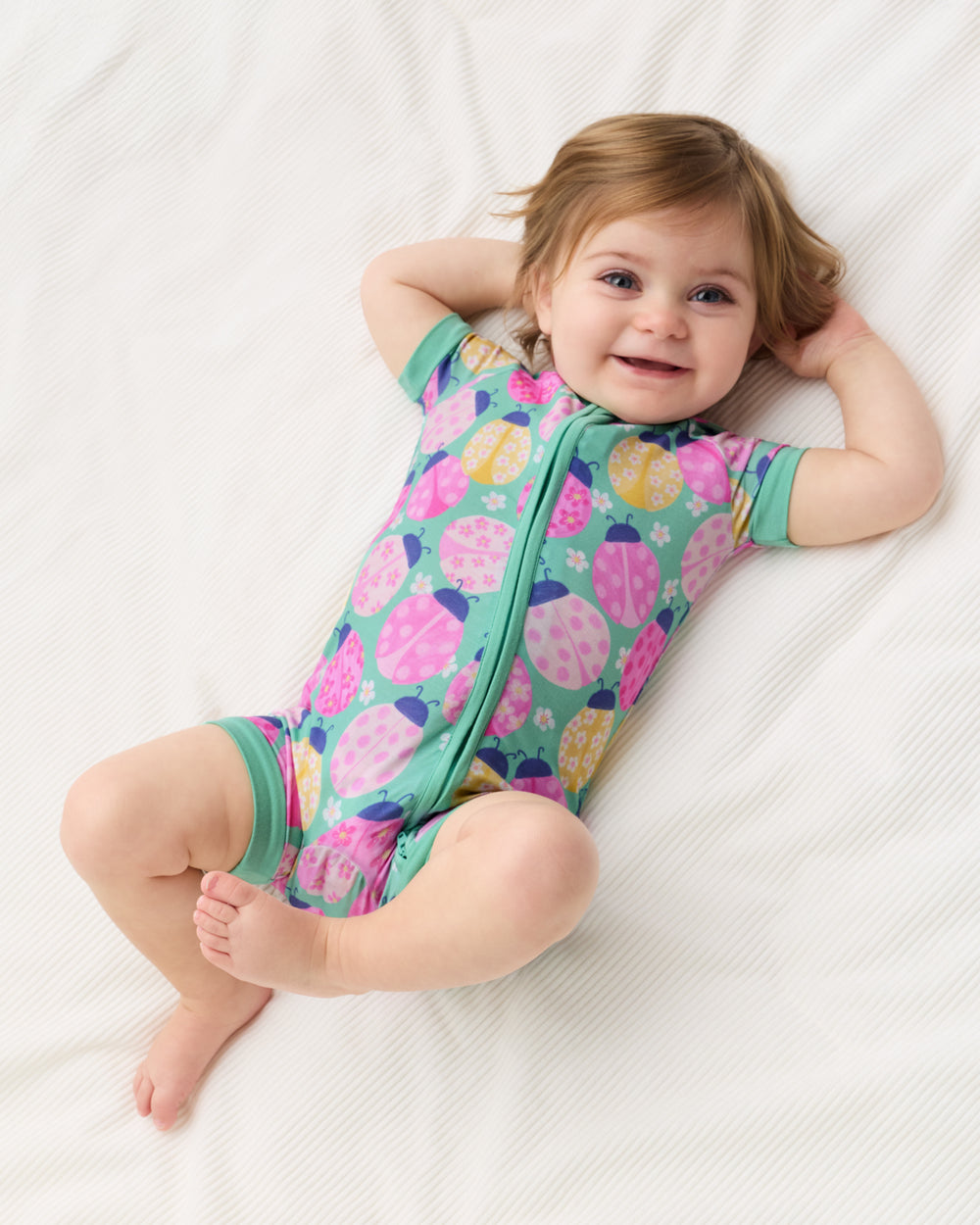Aerial view of alternate child wearing the Ladybug Meadow Shorty Zippy