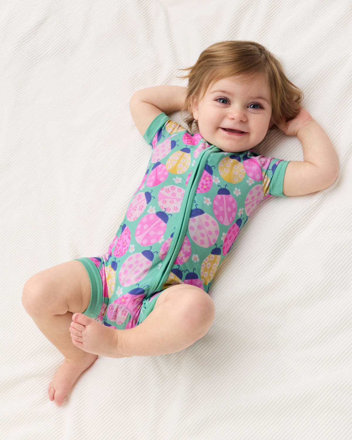 Aerial view of alternate child wearing the Ladybug Meadow Shorty Zippy