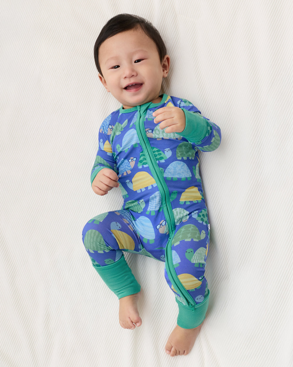 Aerial view of baby wearing the Shell Parade Zippy