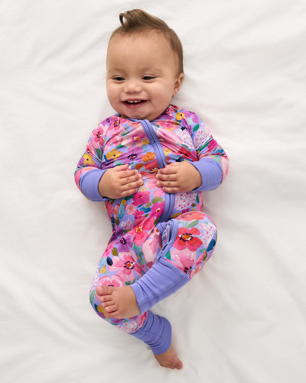 Aerial view of baby wearing the Sweet Sprigs Zippy