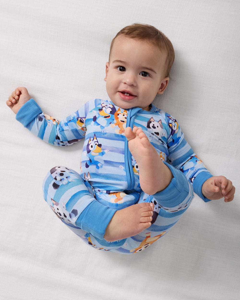 Aerial view of baby wearing the Bluey Dance All Day Zippy