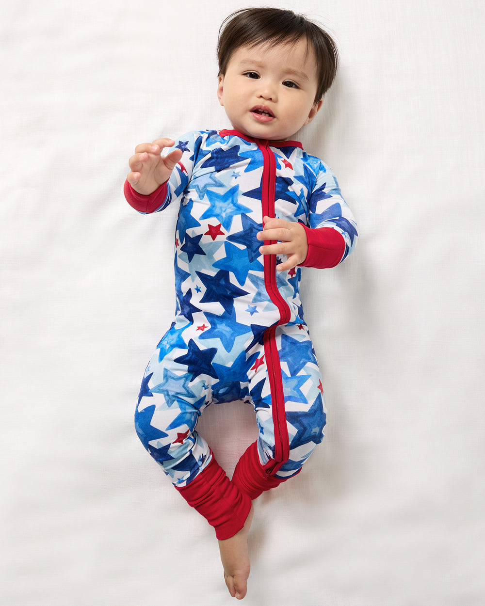 Aerial view of baby wearing the Starry Splash Zippy