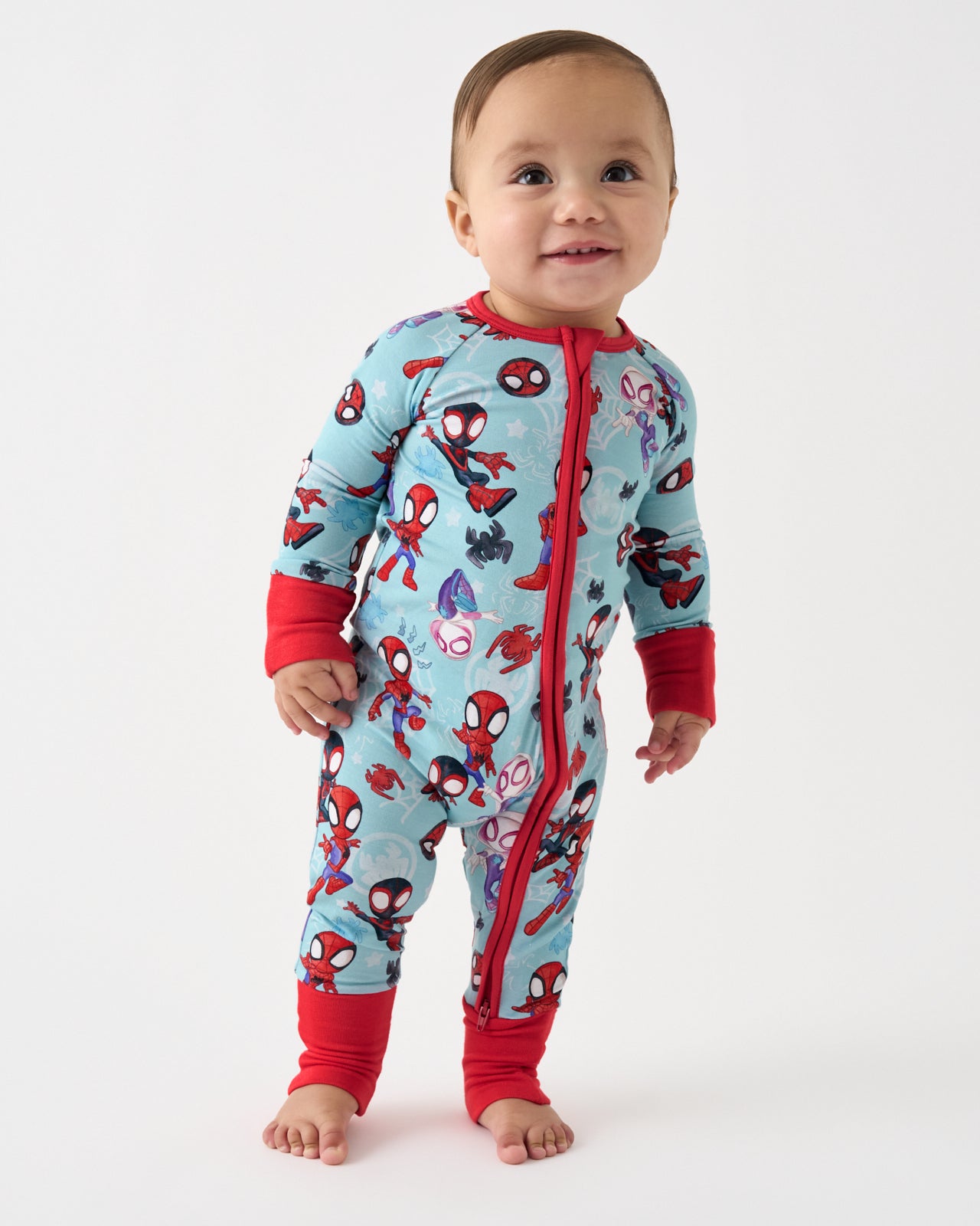 Standing baby wearing the Spidey & Friends Tiny Webs Zippy
