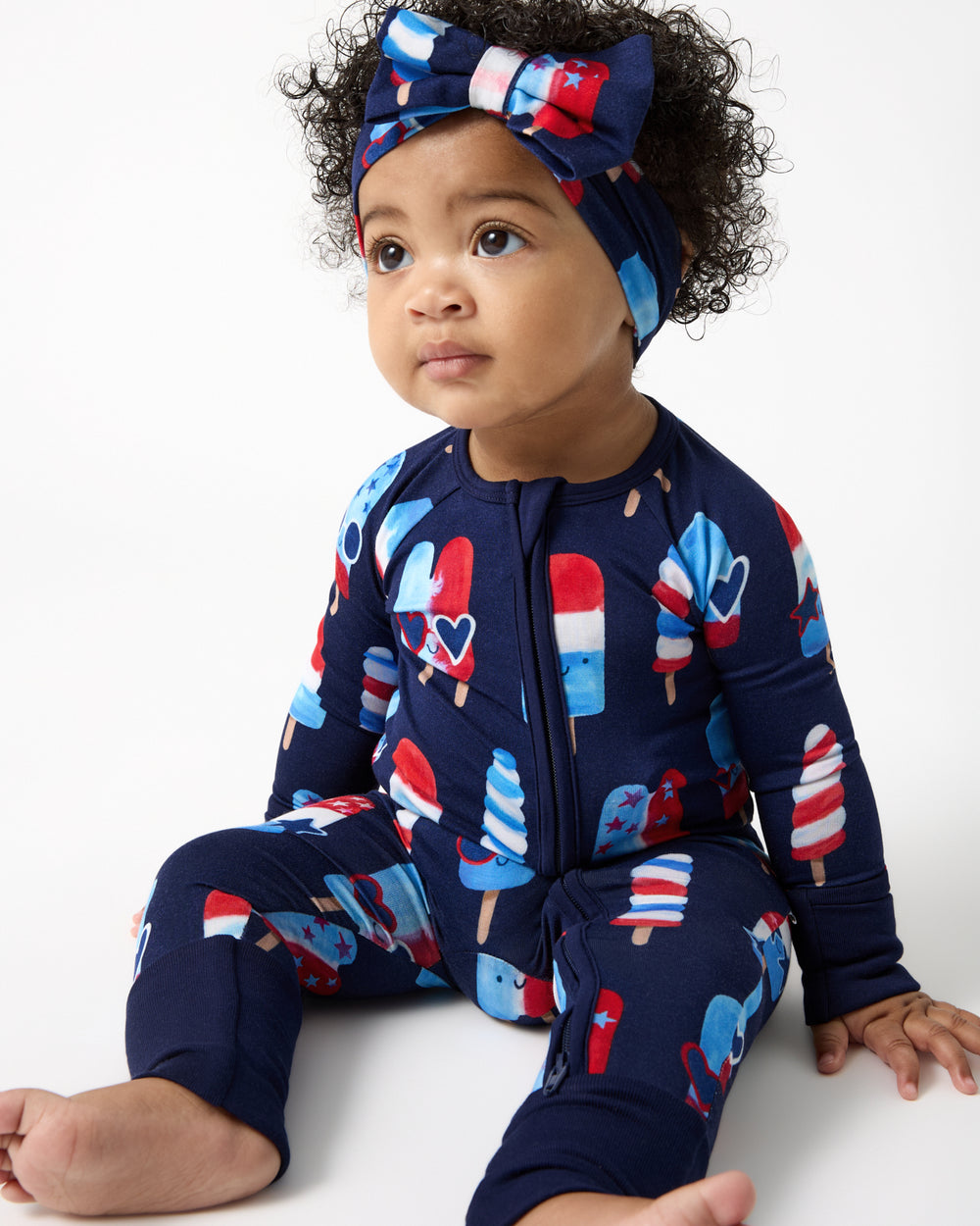 Sitting baby wearing the Sparkle Treats Zippy and Headband
