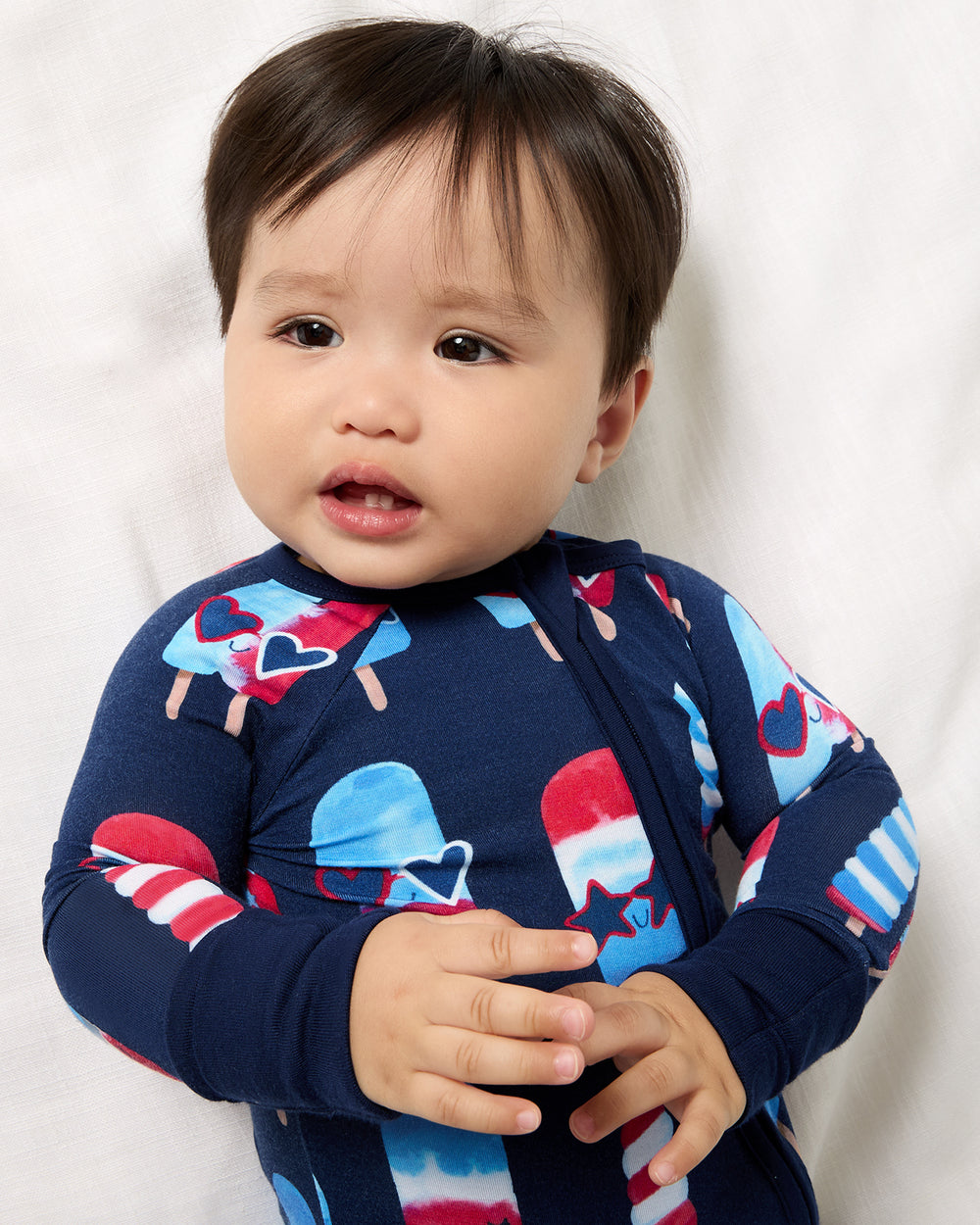 Close up of baby wearing the Sparkle Treats Zippy