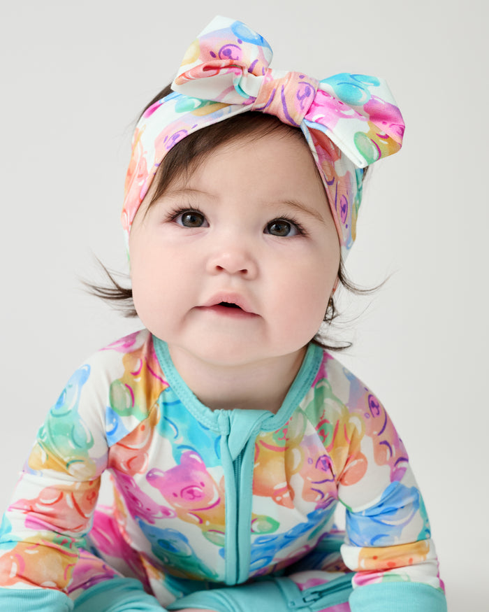 Baby wearing the Gummy Giggles Luxe Bow Headband