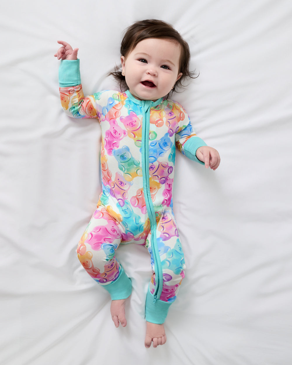 Aerial view of baby wearing the Gummy Giggles Zippy