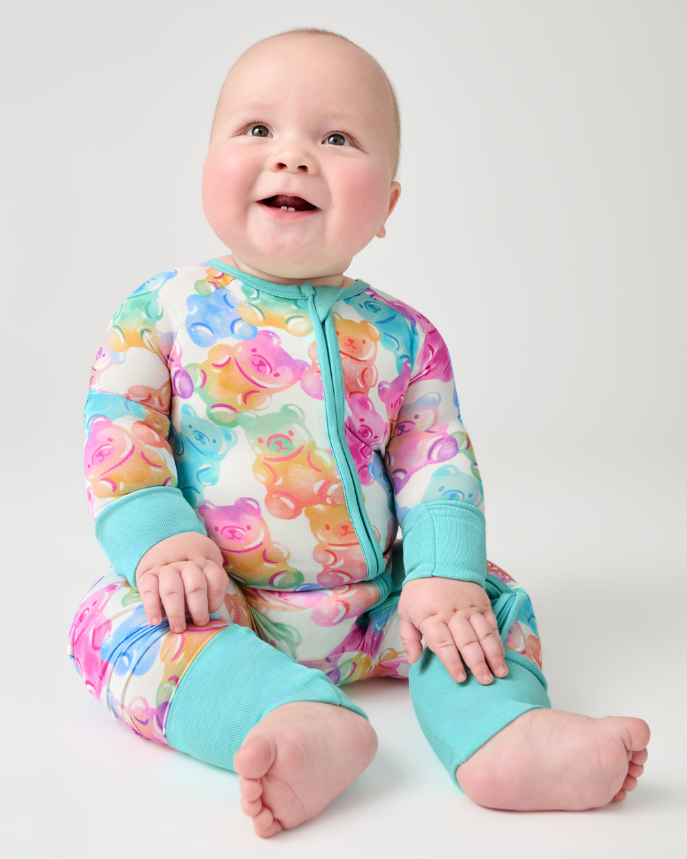 Newborn wearing the Gummy Giggles Zippy